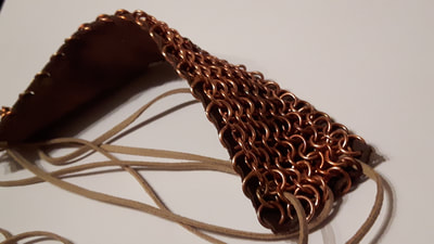 Copper chainmaille and Leather cuff. Starts at £45. Other designs and materials available.