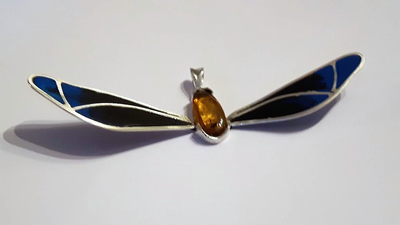 'Fly by Night' Silver, natural amber (with fosillised fly and resin pendant.Choice of chain available and different designs, colours available. Prices on enquiry.